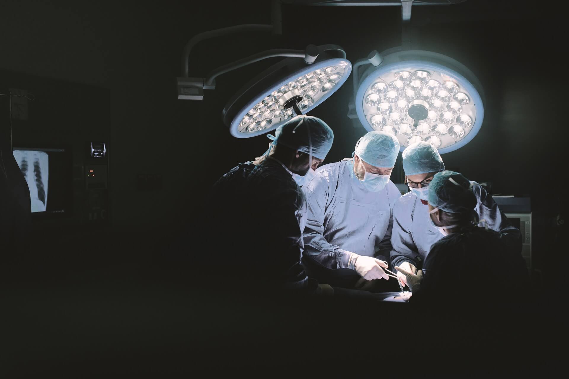 Surgeons operating in theater